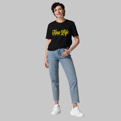 Woman wearing a black organic cotton t-shirt with 'New Life' print and AShamaluevMusic logo in yellow text on a grey background