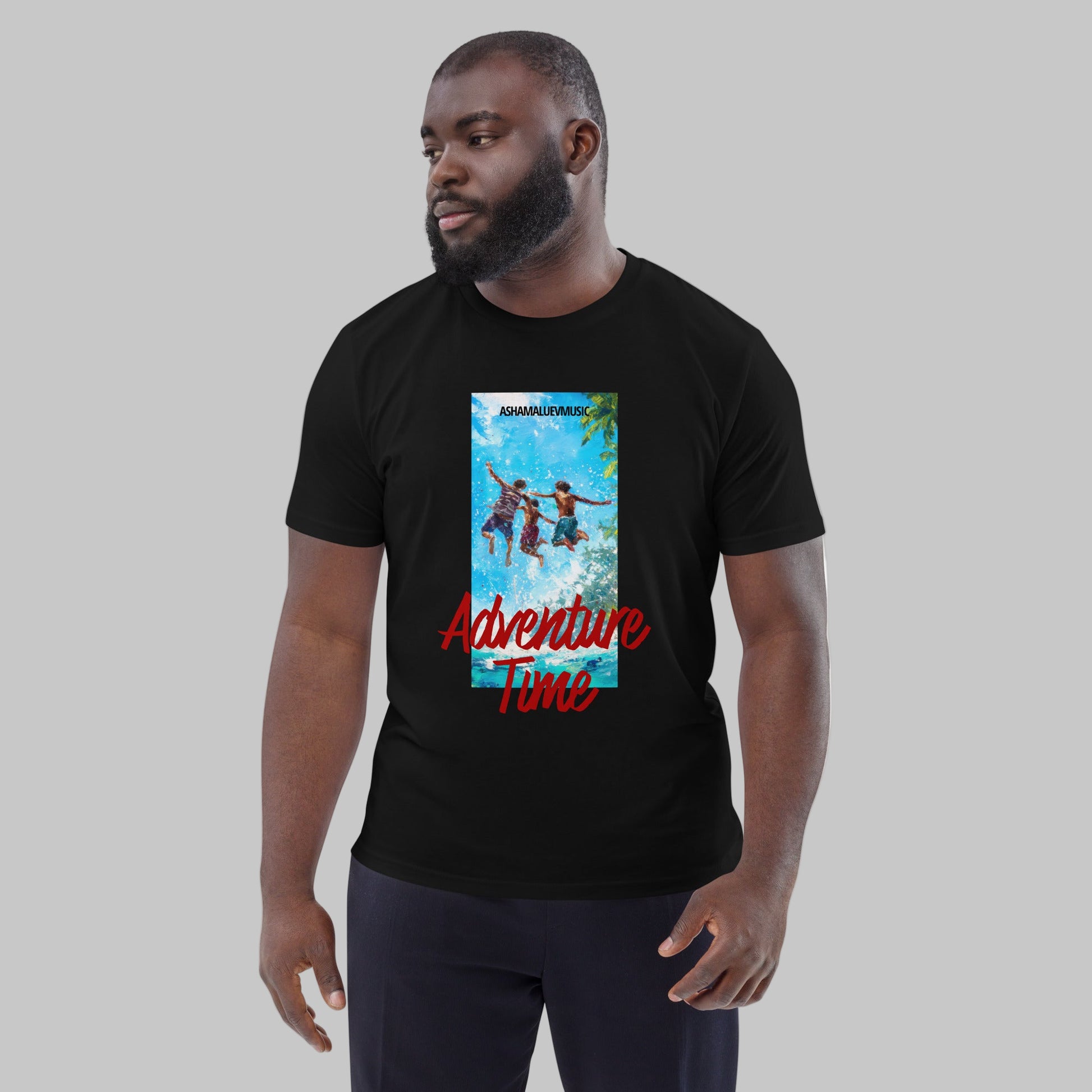 Man wearing a black t-shirt with 'Adventure Time' graphic design and AShamaluevMusic logo on a grey background.