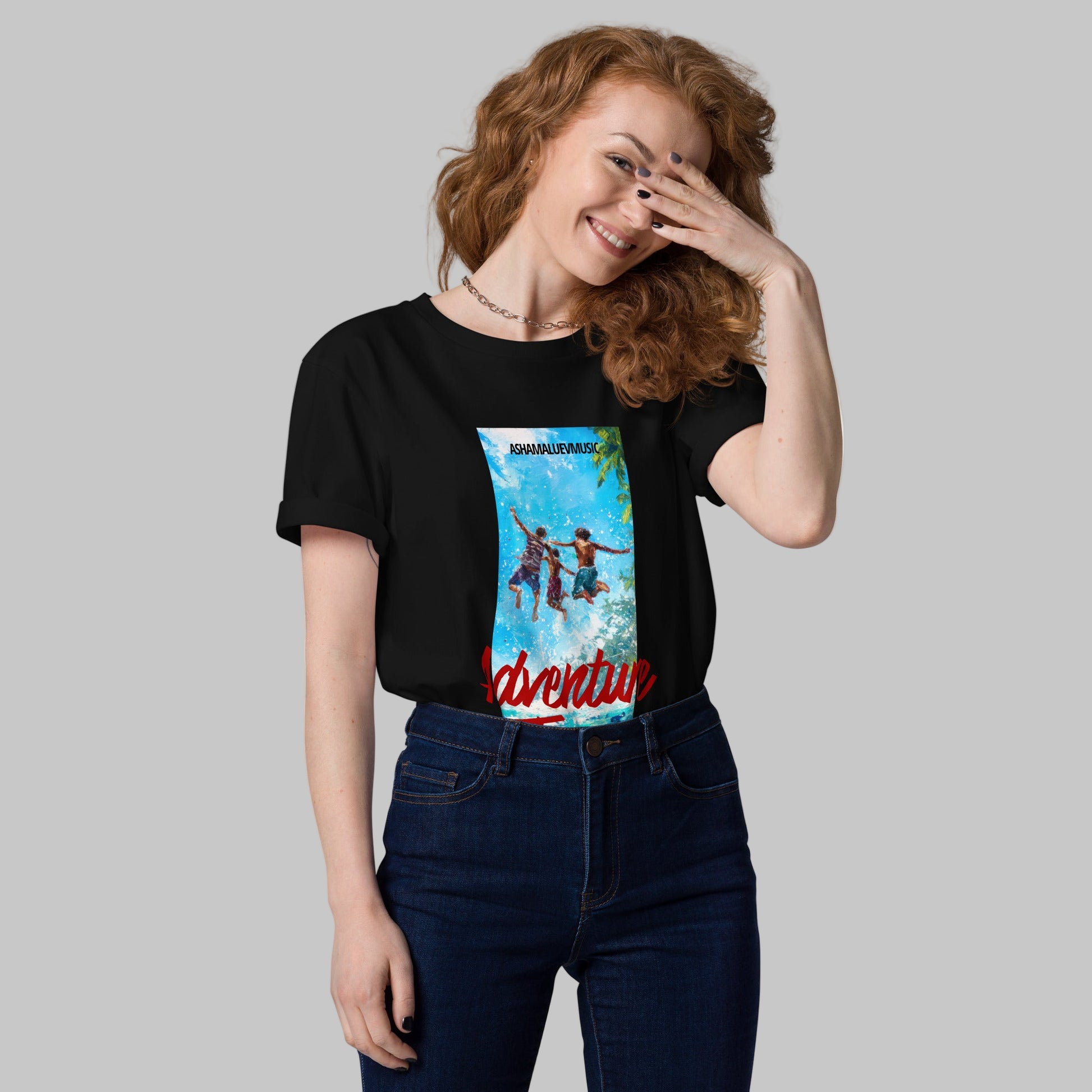 Woman wearing a black t-shirt with 'Adventure Time' graphic design and AShamaluevMusic logo on a grey background.