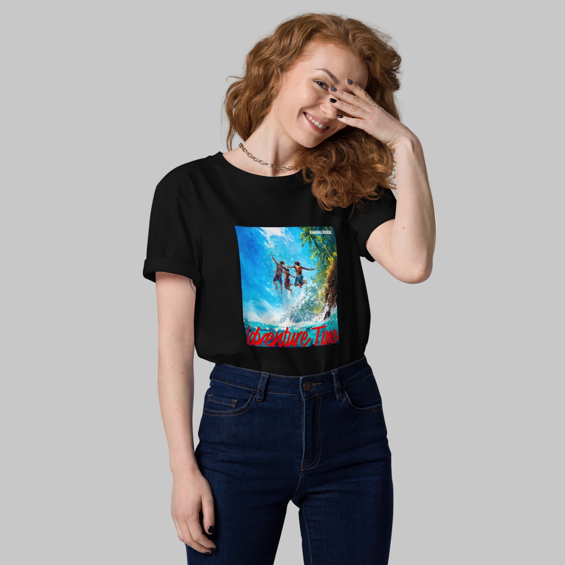 Woman wearing a black t-shirt with a 'Adventure Time' graphic design and AShamaluevMusic logo on a grey background.