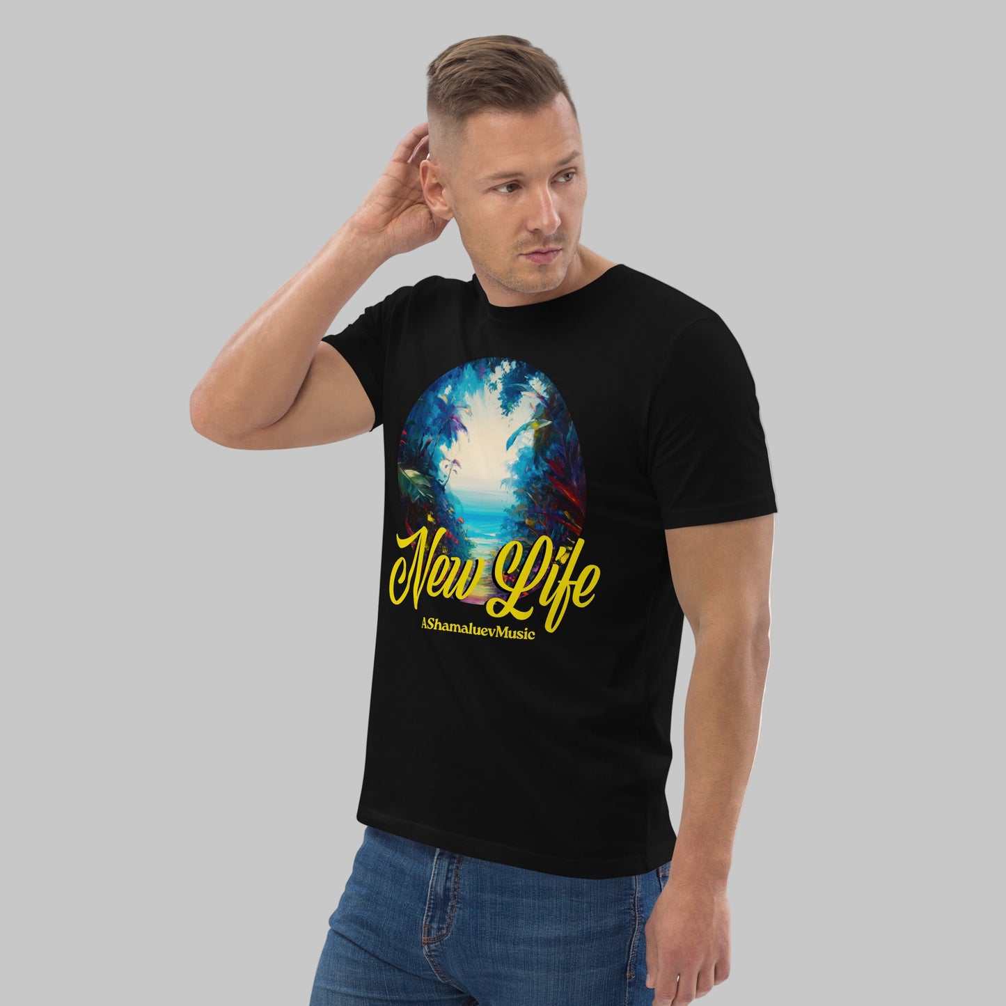 Man wearing a black organic cotton t-shirt with 'New Life' print and AShamaluevMusic logo on a light grey background