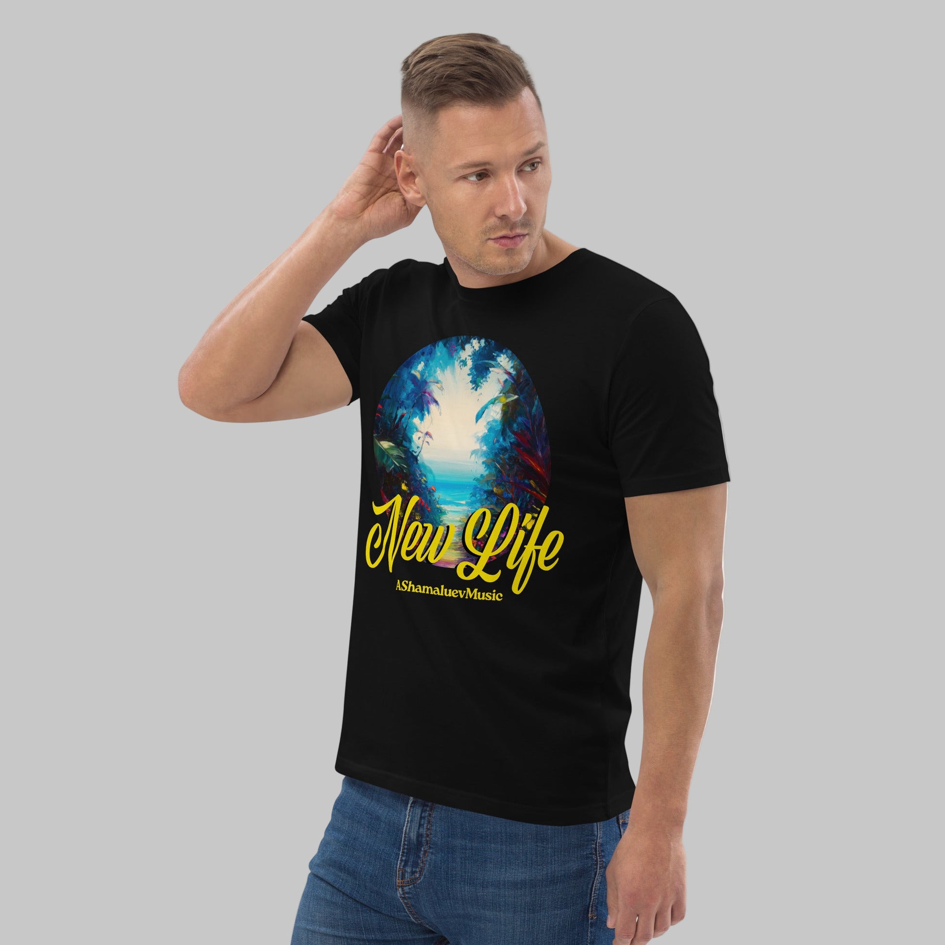 Man wearing a black organic cotton t-shirt with 'New Life' print and AShamaluevMusic logo on a light grey background