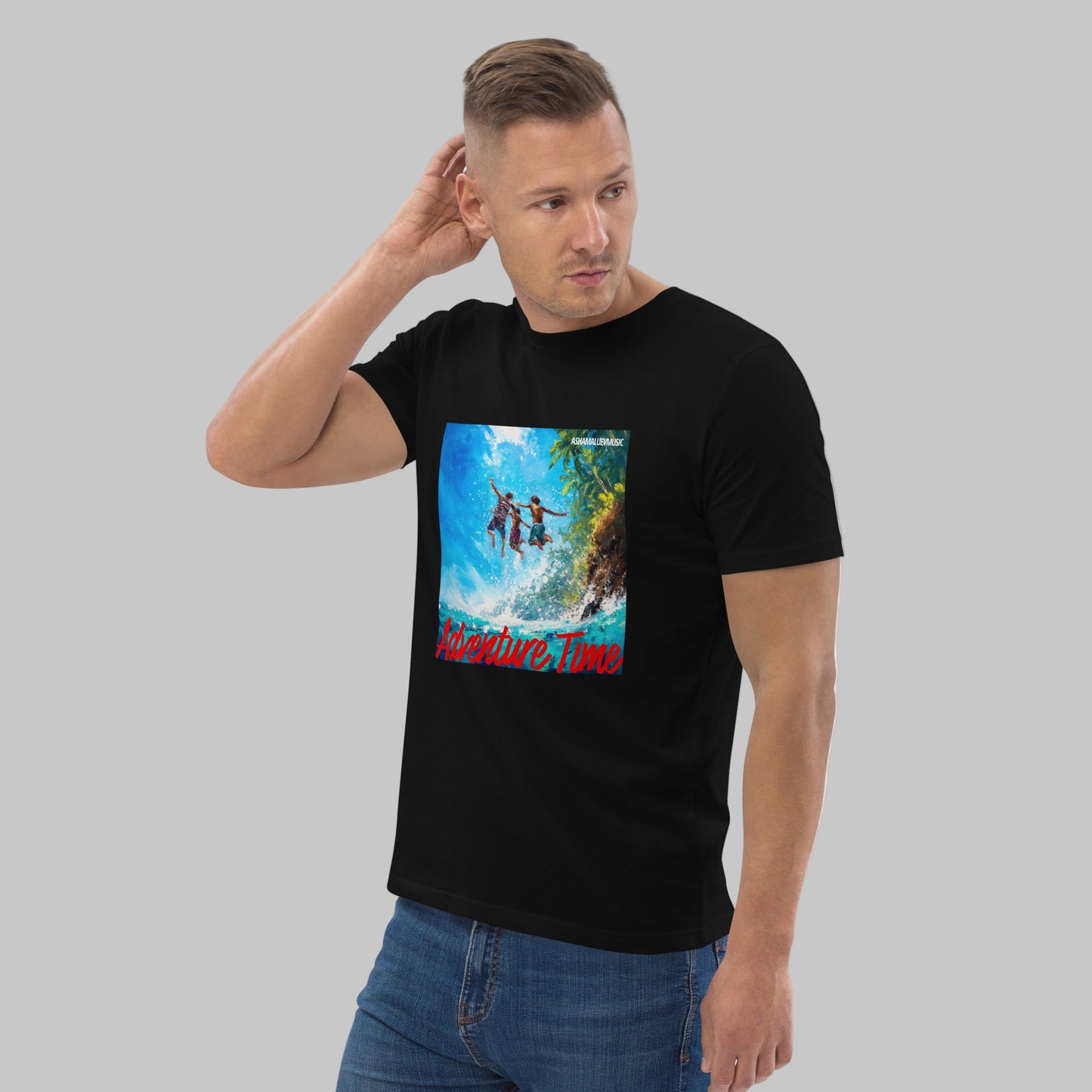 Man wearing a black t-shirt with a 'Adventure Time' graphic design and AShamaluevMusic logo on a grey background.