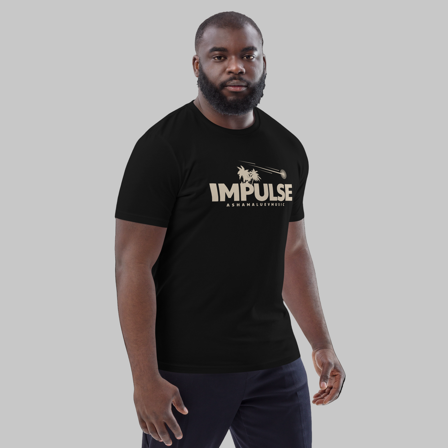 Man wearing a black t-shirt with text 'IMPULSE' and AShamaluevMusic logo on a grey background