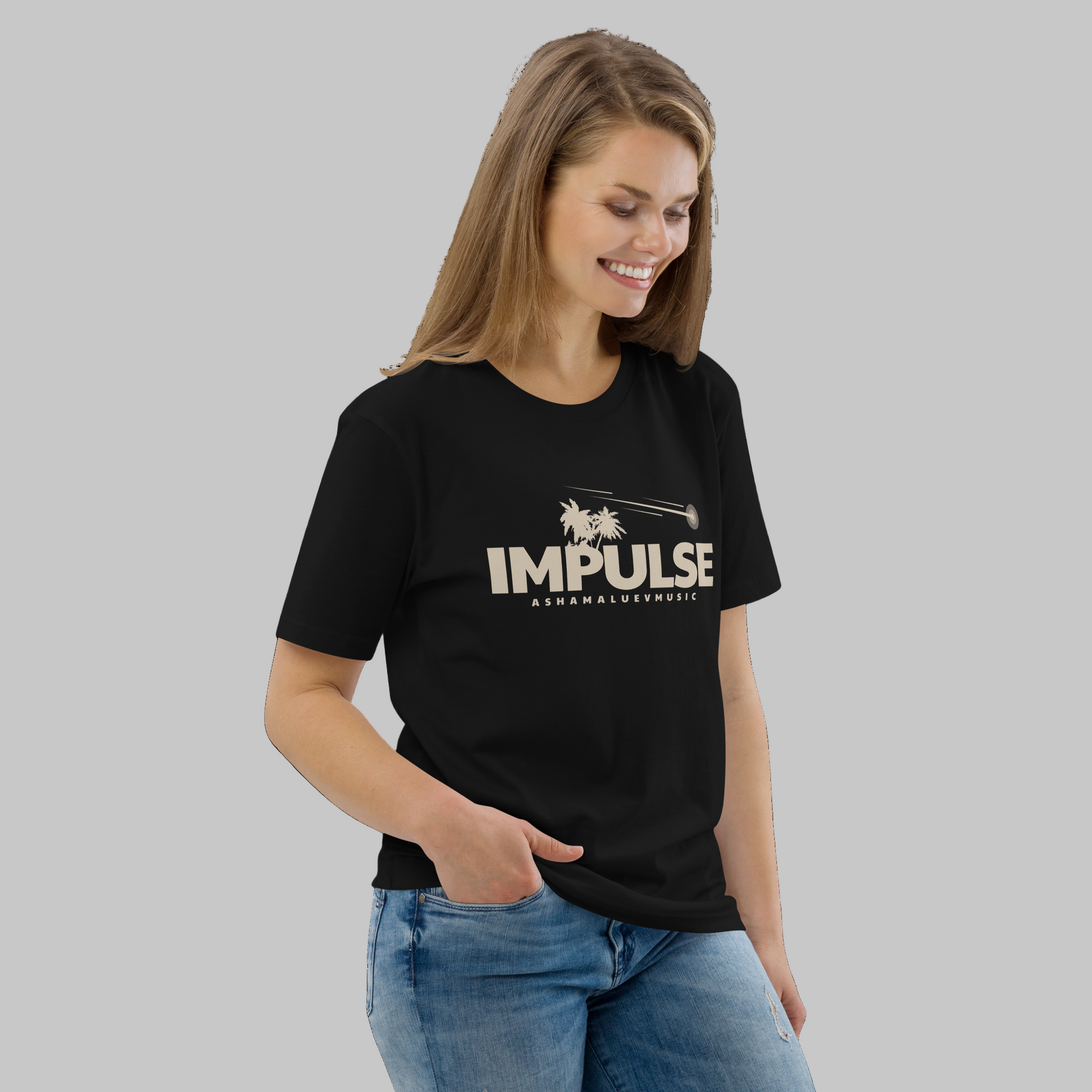 Woman wearing a black t-shirt with 'IMPULSE' logo on a grey background