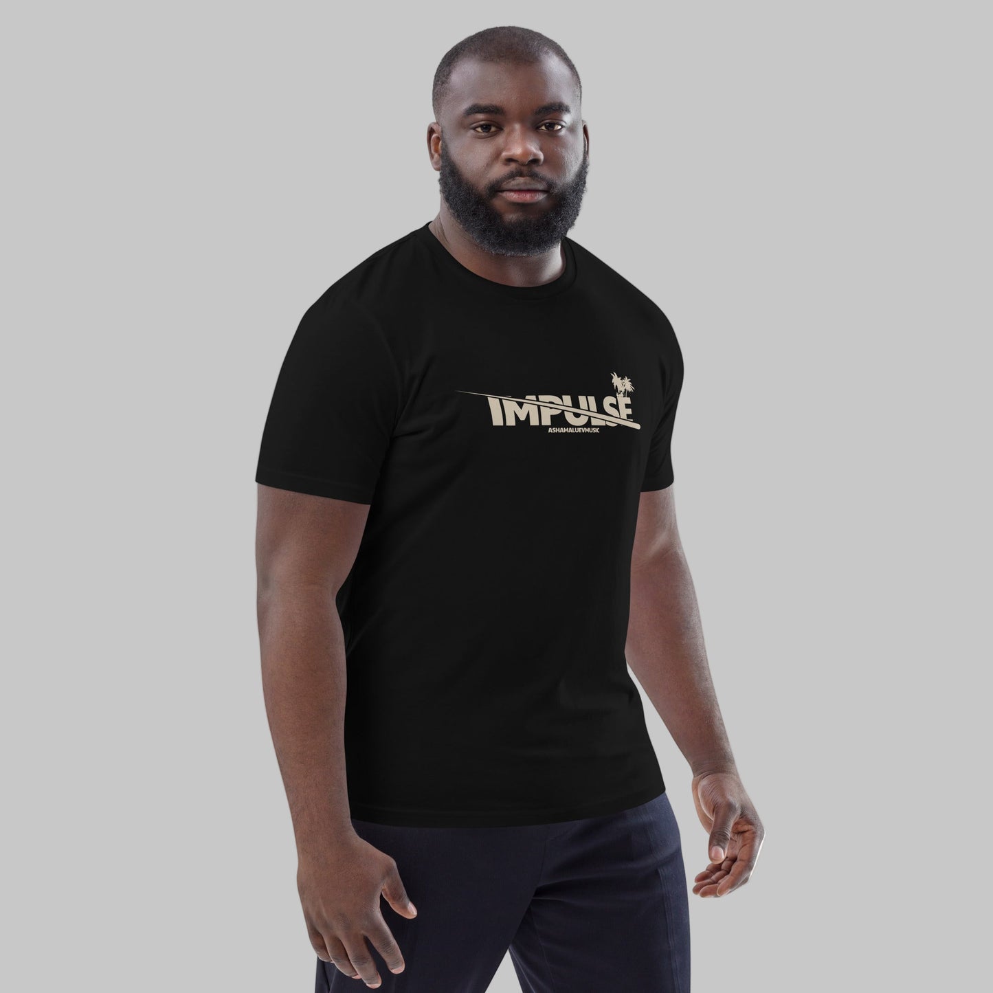 Man wearing a black t-shirt with text 'IMPULSE' and AShamaluevMusic logo on a grey background