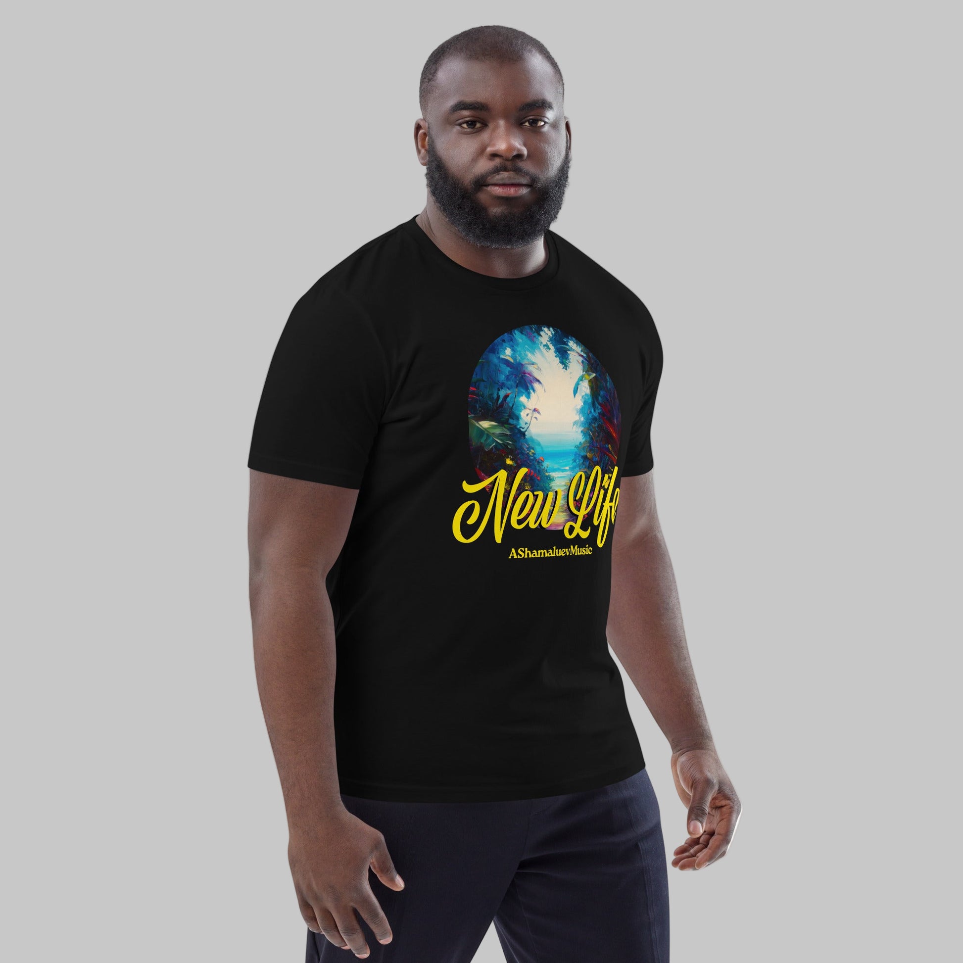 Man wearing a black organic cotton t-shirt with 'New Life' print and AShamaluevMusic logo on a light grey background