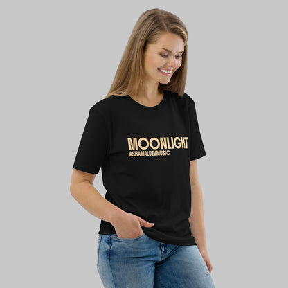 Woman wearing a black organic cotton t-shirt with 'Moonlight' print and AShamaluevMusic logo on a light grey background