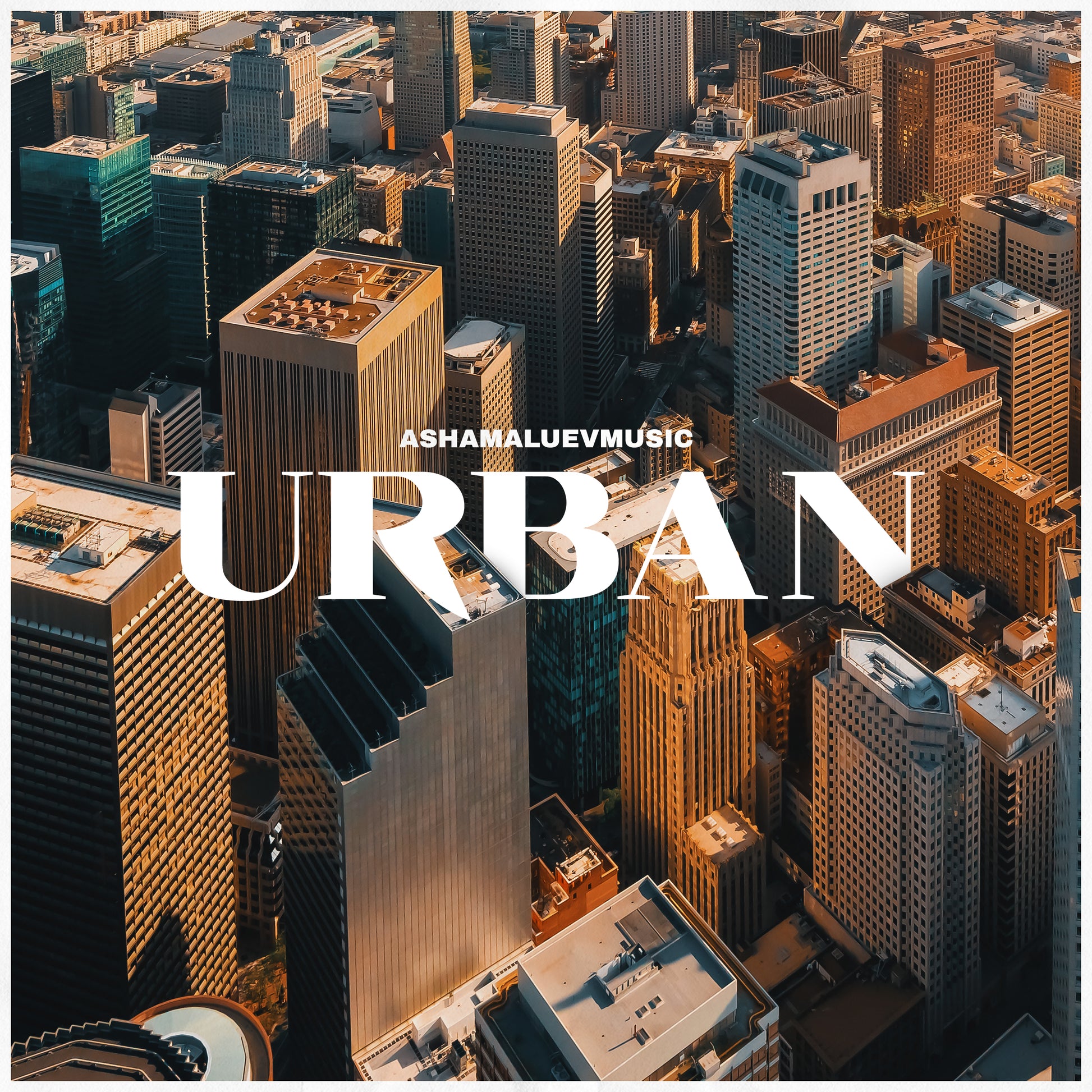 Cover art of the music track 'Urban' by AShamaluevMusic, which shows the aerial view of a cityscape with skyscrapers.