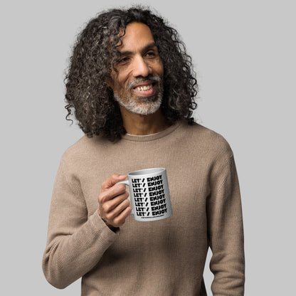 Man holding a mug with text 'Let's Enjoy' and 'AShamaluevMusic' on a white background