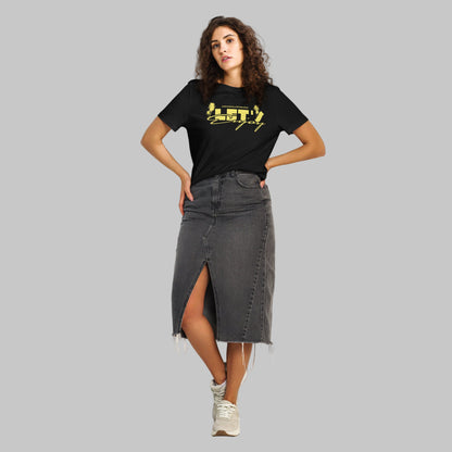 Woman wearing a black t-shirt with yellow graphics 'Let's Enjoy' and AShamaluevMusic logo on a grey background