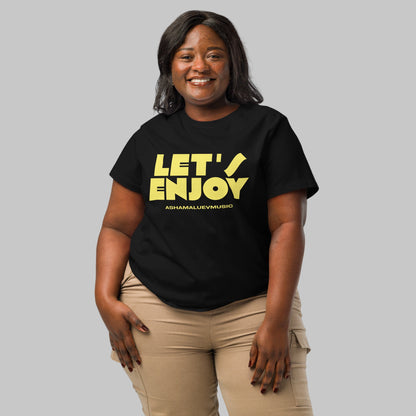 Woman wearing a black t-shirt with a 'Let's Enjoy' print and AShamaluevMusic logo on a grey background