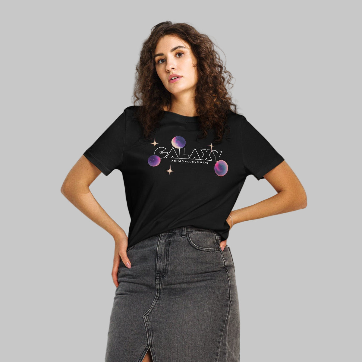 Woman wearing a black t-shirt with a 'Galaxy' design and AShamaluevMusic logo on a white background