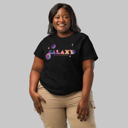 Woman wearing a black t-shirt with a 'Galaxy' design and AShamaluevMusic logo on a light grey background