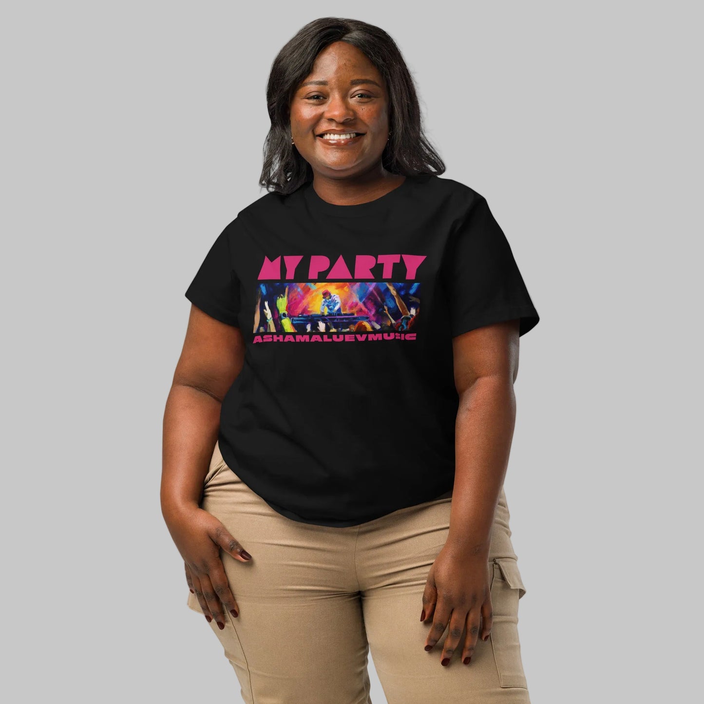 Woman wearing a black t-shirt with graphic and text 'MY PARTY' and 'ASHAMALUEVMUSIC' on a gray background