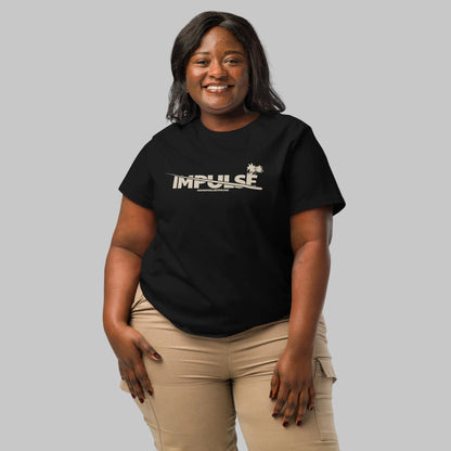 Woman wearing a black women's organic short sleeve t-shirt with beige text 'IMPULSE' and AShamaluevMusic on a gray background