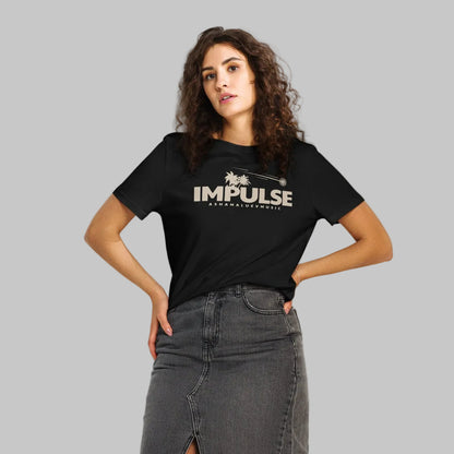 Woman wearing a black organic short sleeve t-shirt with beige text 'IMPULSE' and 'AShamaluevMusic' on a gray background