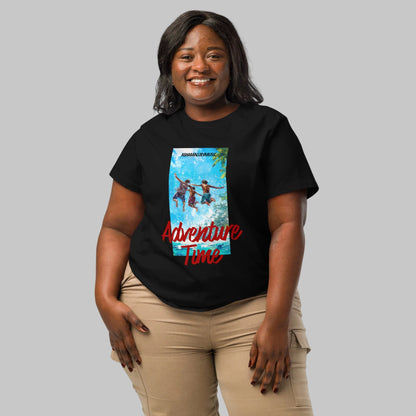 Woman wearing a black organic short sleeve t-shirt with a 'Adventure Time' colorful graphic and text 'AShanaluevMusic' on a gray background