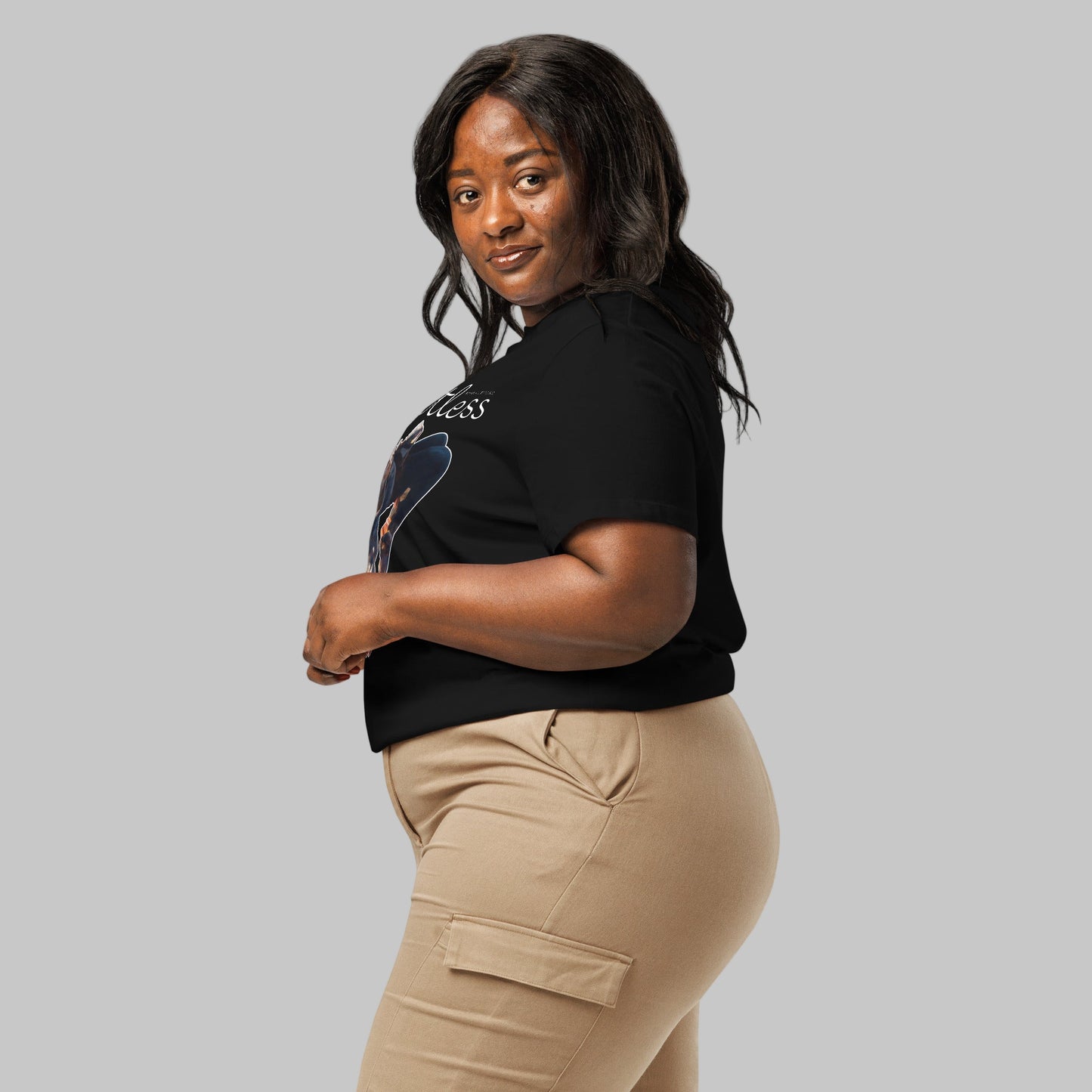 Woman wearing a black t-shirt with a 'Weightless' design and AShamaluevMusic logo on a light grey background