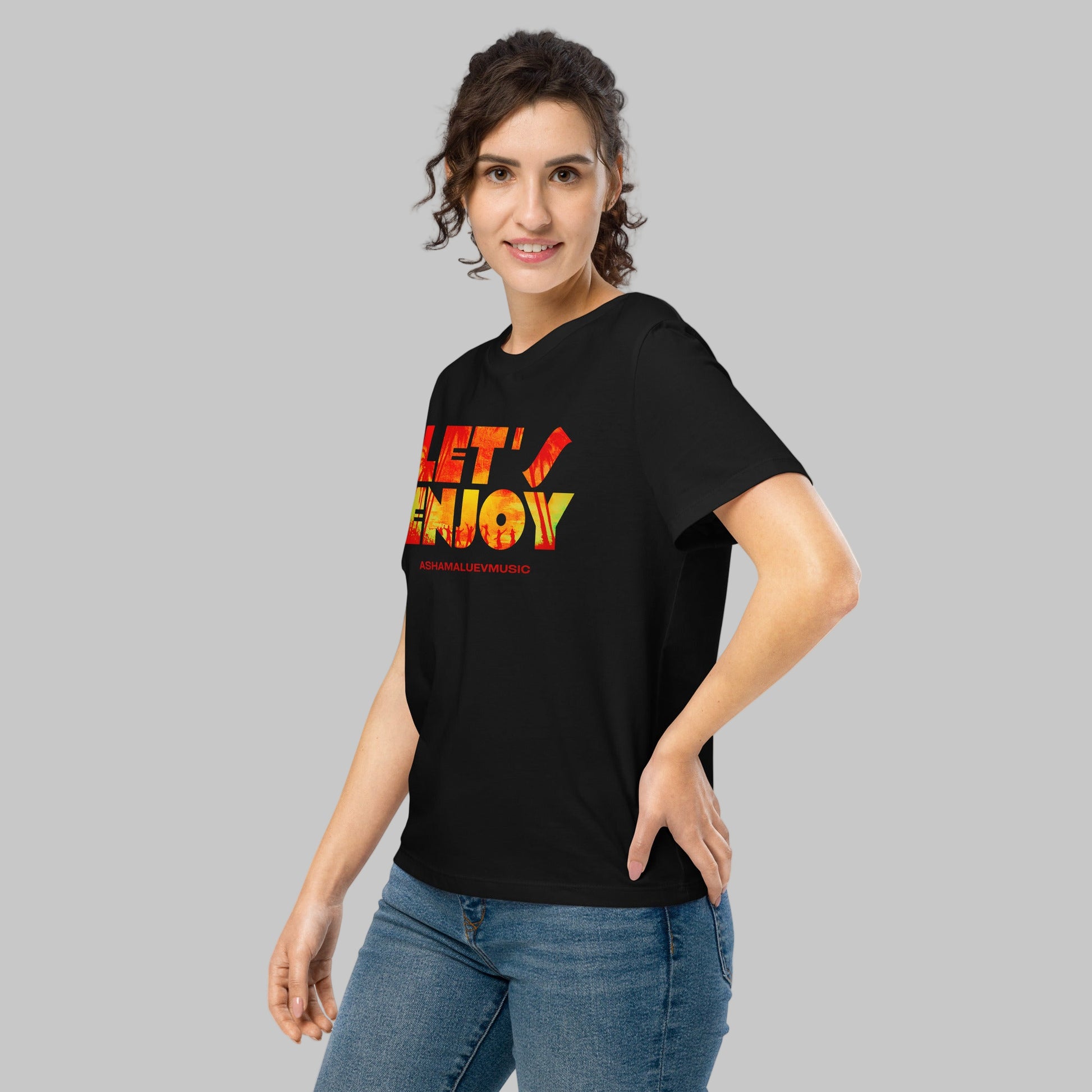 Woman wearing a black t-shirt with 'LET'S ENJOY' text and AShamaluevMusic logo in colorful letters on a grey background